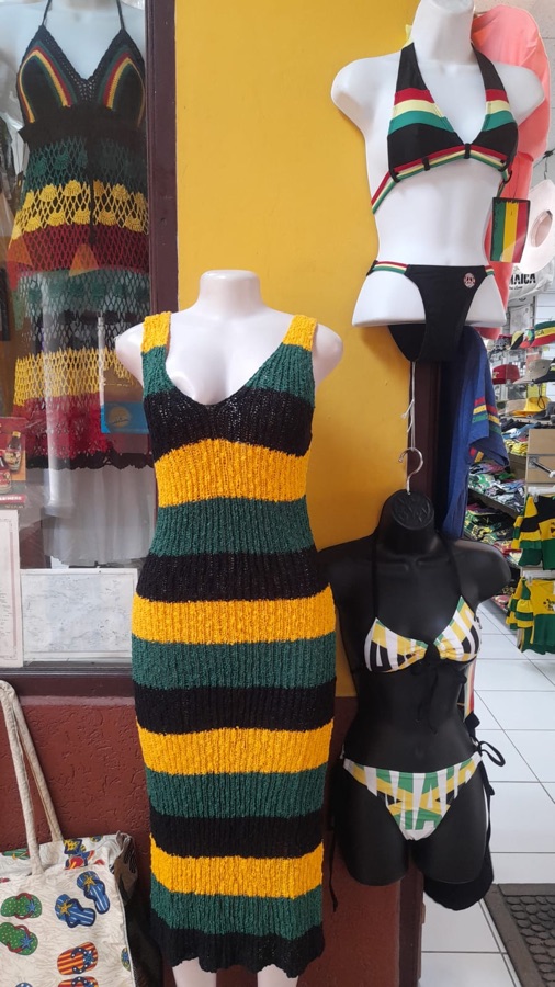Hand-knit dress and Jamaica bikini swimwear display on a mannequin