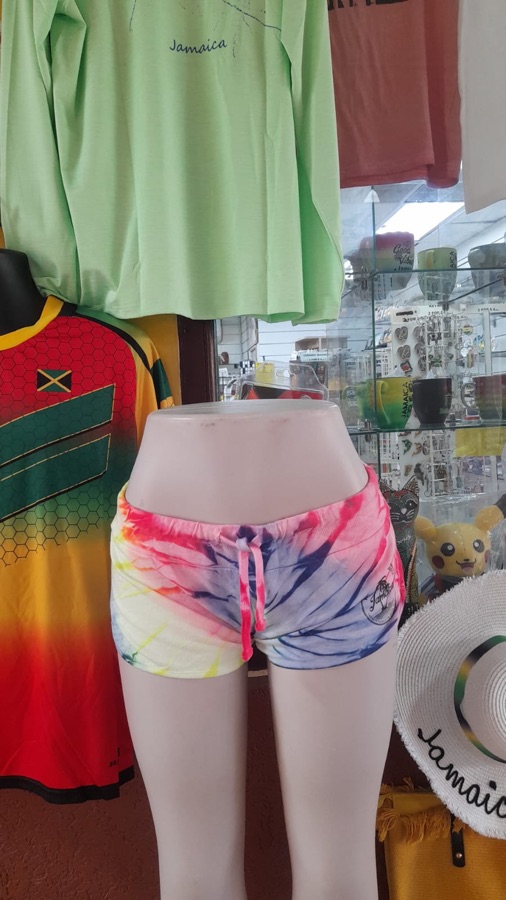 Tie-dye Jamaica beach shorts on a mannequin